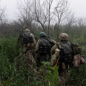 Troops in the Russia Ukraine War walking outside.