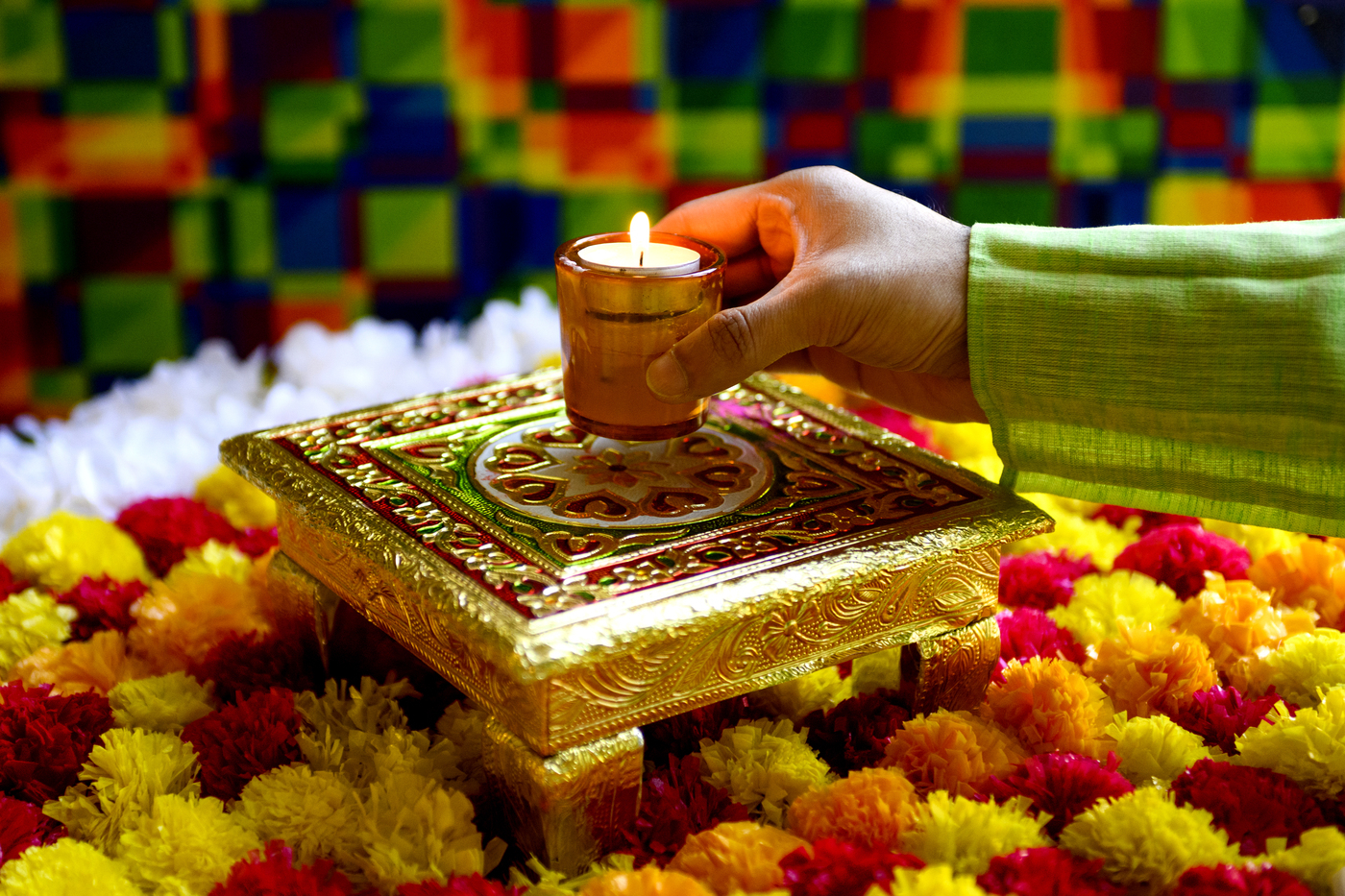 Sagar Rajpul placing a candle.