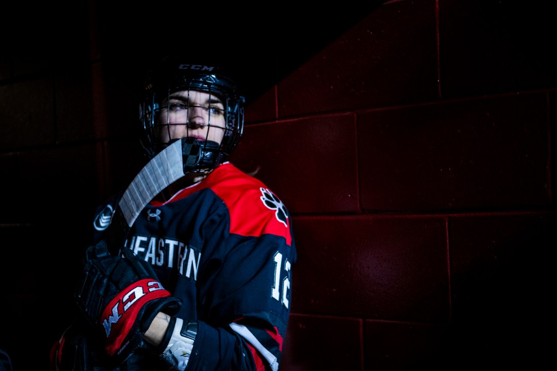 Northeastern women's hockey player in gear.