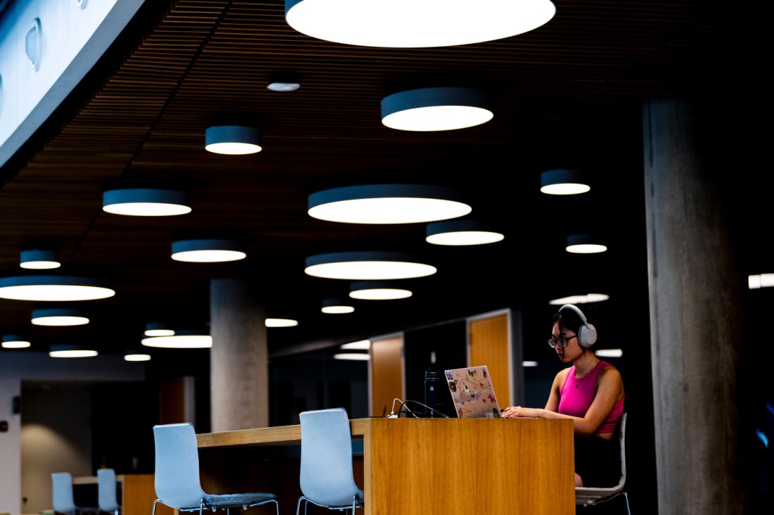 Person working on their laptop in ISEC.
