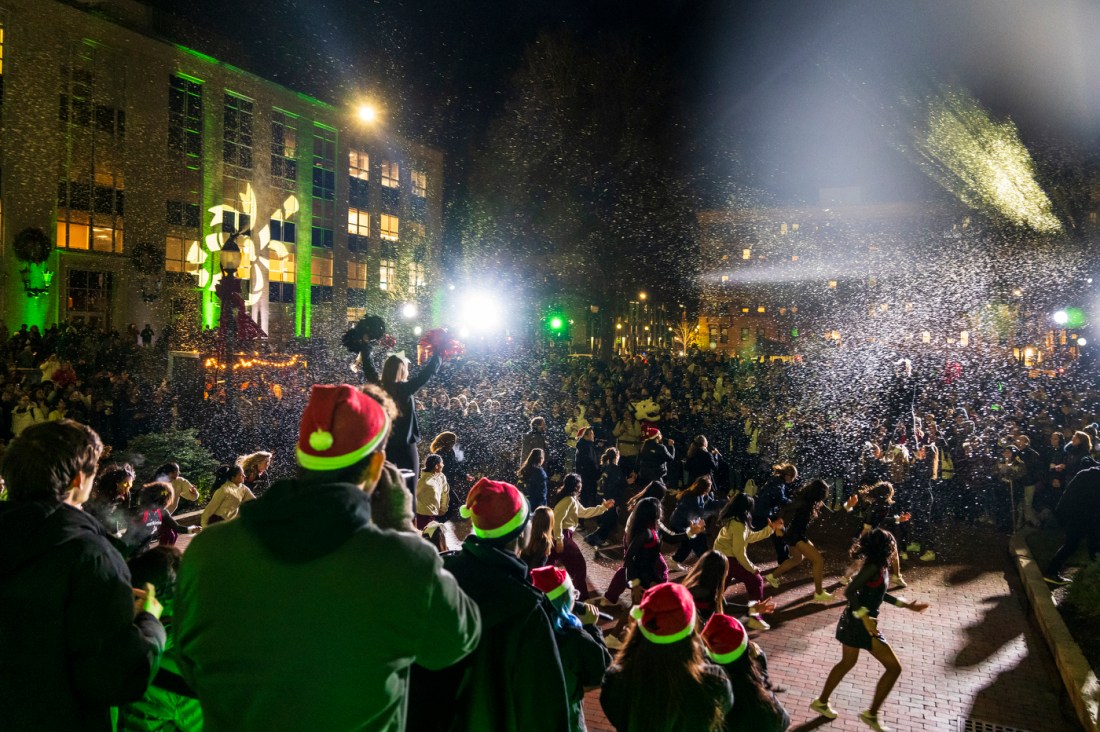 A large crowd cheers during Northeastern's Joy and Light Holiday Showcase.