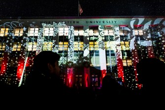 An extensive set of special lighting effects is displayed outside Northeastern's Ell Hall.