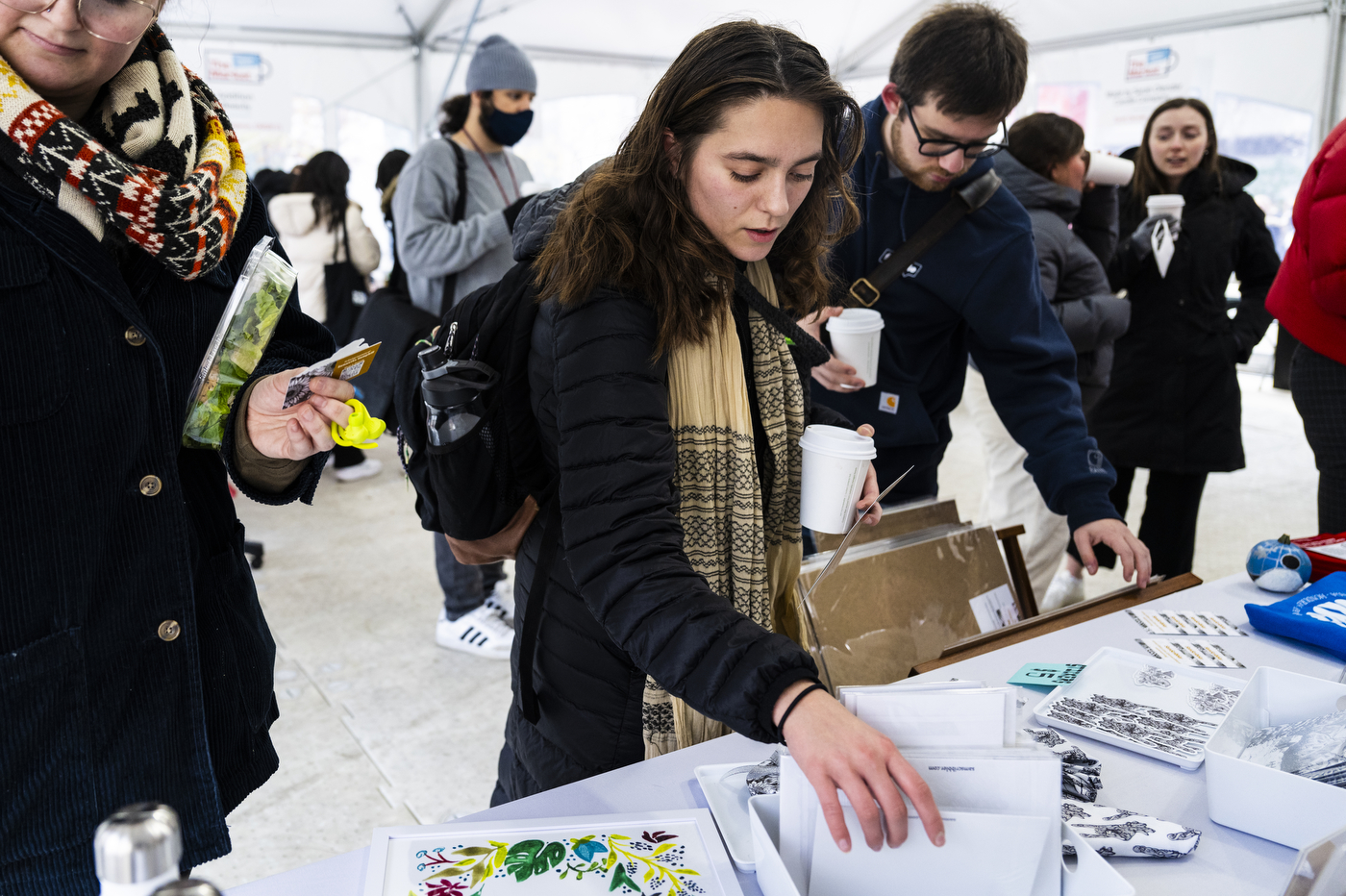 Members of the Northeastern community shopping at the holiday market.