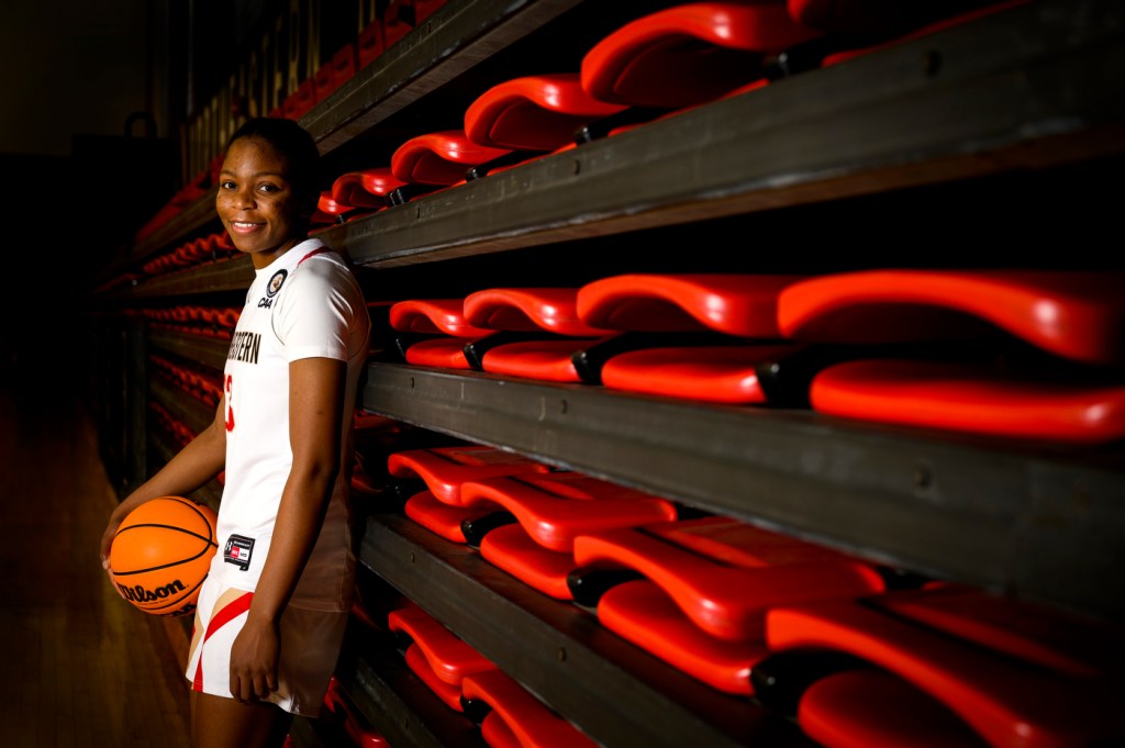 Gemima Motema posing with a basketball.