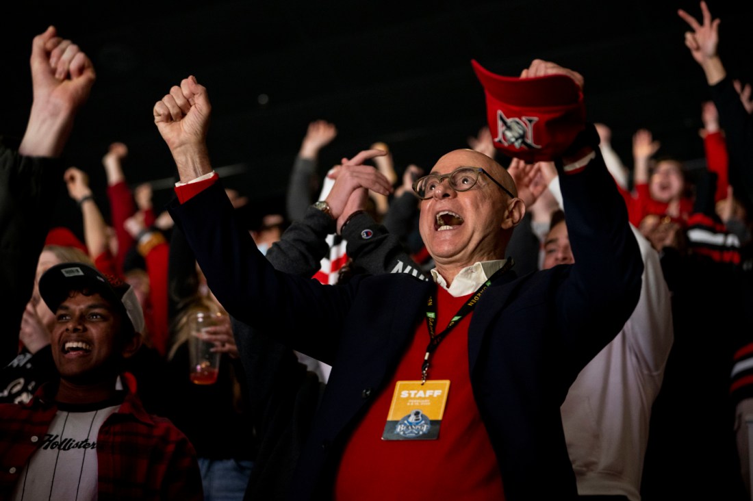 President Aoun cheering at a Beanpot hockey game.