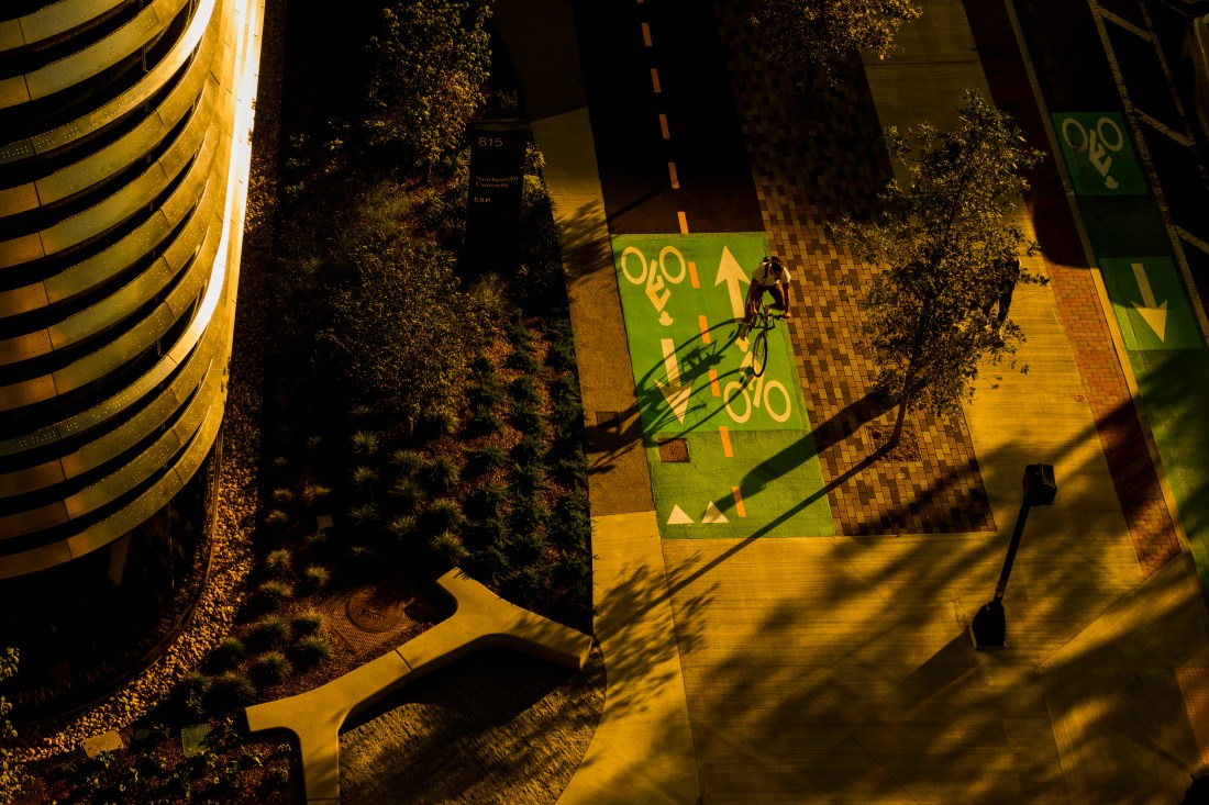 Overhead shot of a person riding their bike on the bike line outside of EXP.
