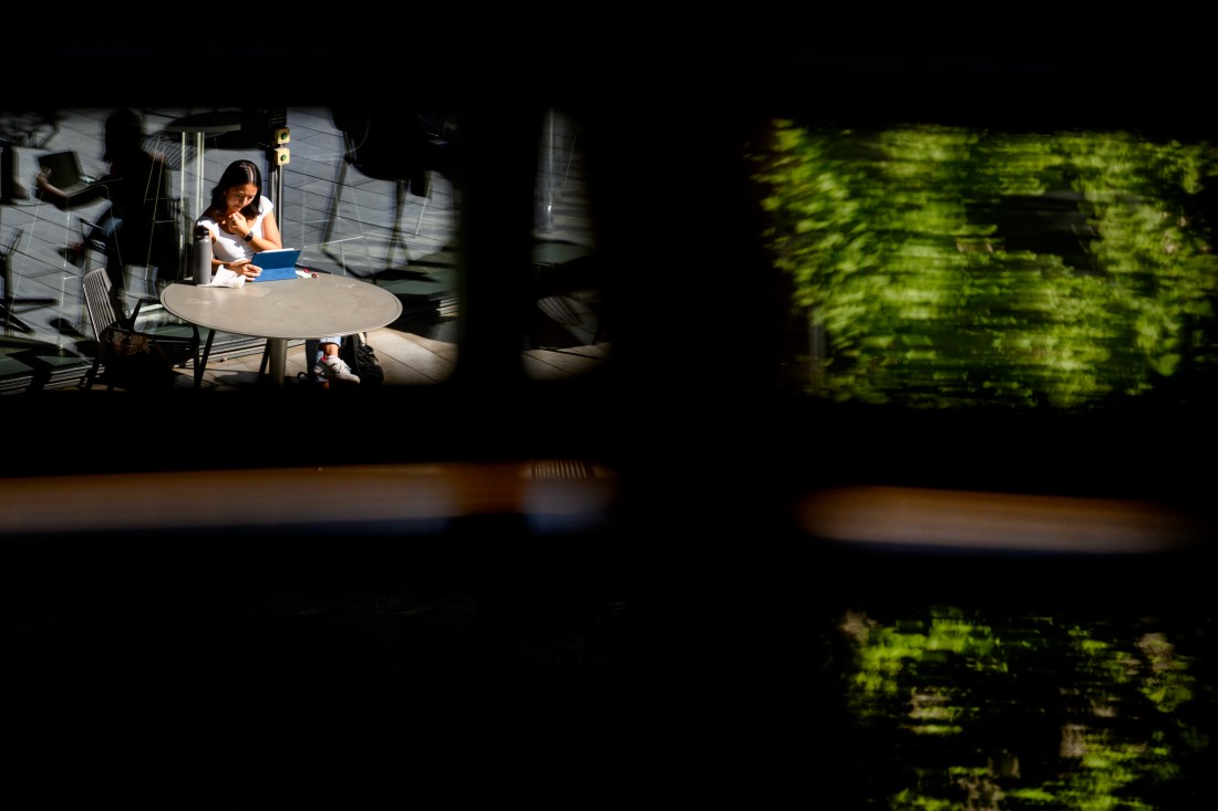 Northeastern community member sitting at a round table. 