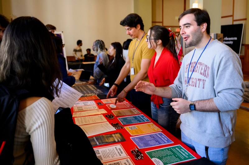 Northeastern community members tabling and talking to students at the Involvement Fair.