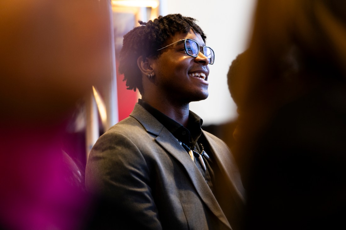 An attendee smiles during at Northeastern's MLK event.