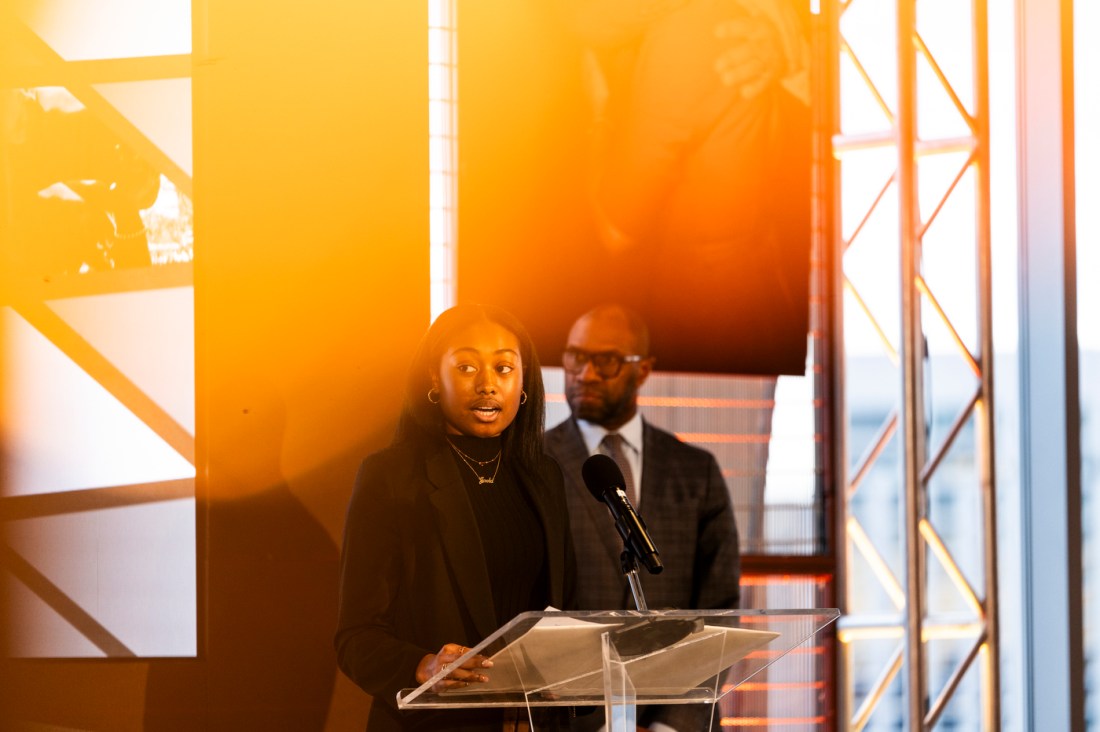 A speaker talks at a podium during Northeastern's MLK event.