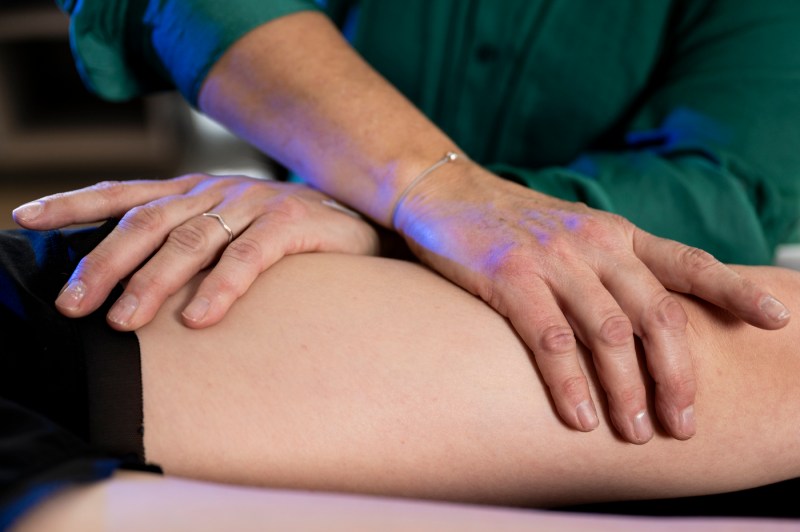 Dr. Maureen Watkins helping a student with fascia release.