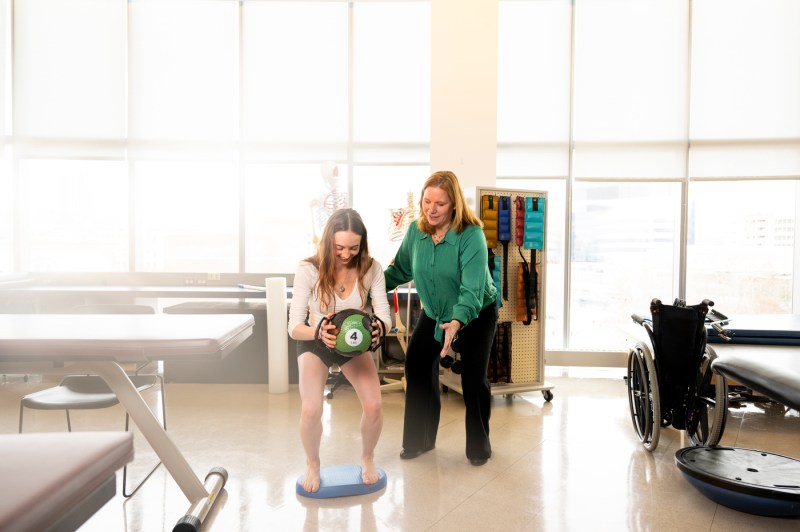 Dr. Maureen Watkins helping a student with fascia release.