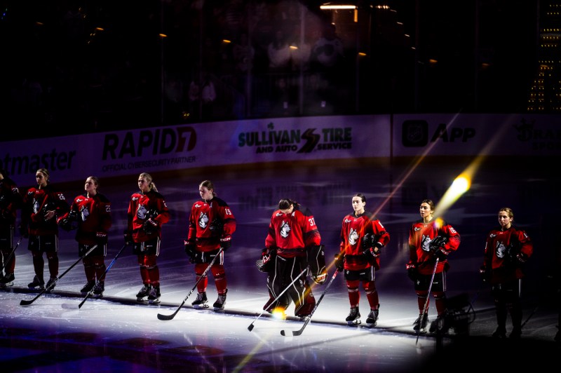 Northeastern women's hockey team lined up on the ice for the Beanpot championship.