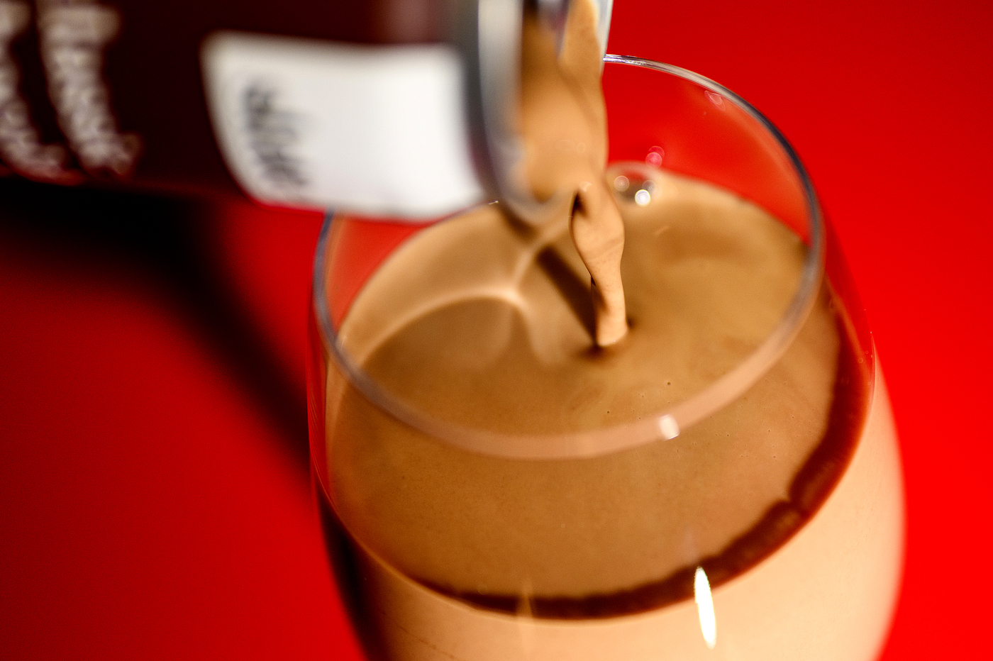 Slate Chocolate Milk being poured from can into a glass.