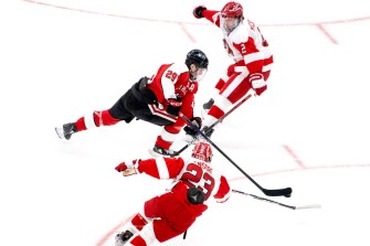 Men's hockey players on the ice.