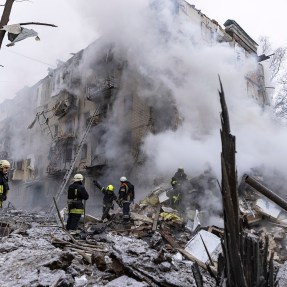 Smoke billowing from an apartment building in Ukraine that had been hit by a Russian missile.