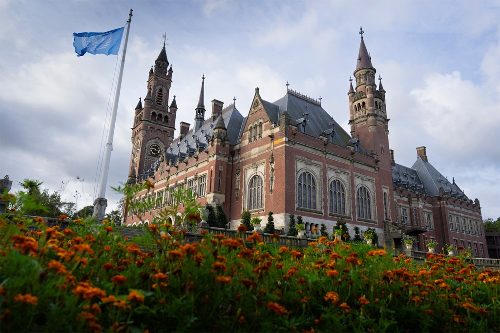 A palace displayed in the sunlight on a cloudy day.