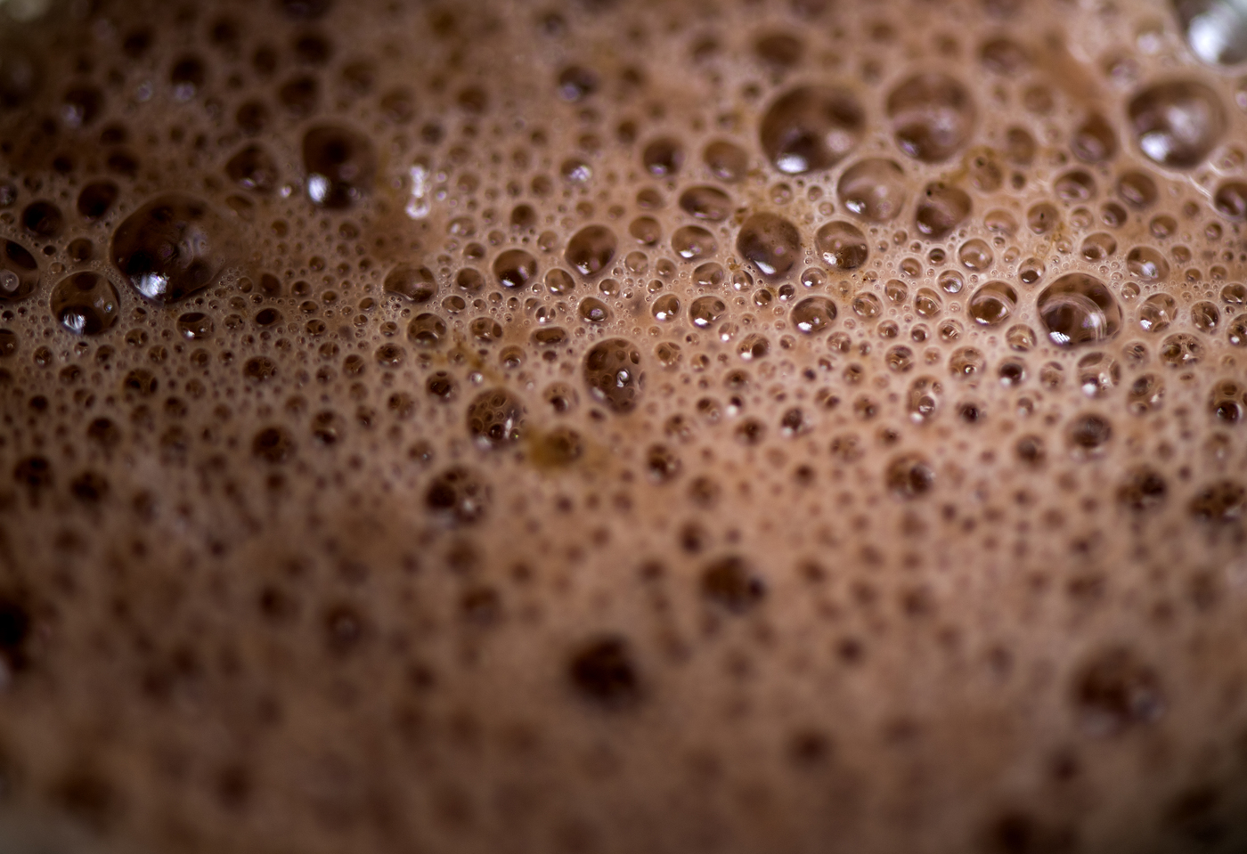 Bubbles in a glass of Slate Chocolate Milk.