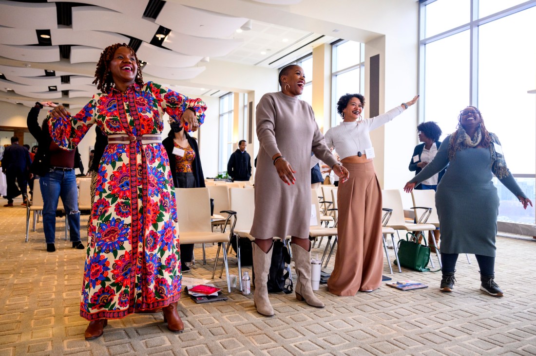 Audience members dance at the annual bell hooks symposium.