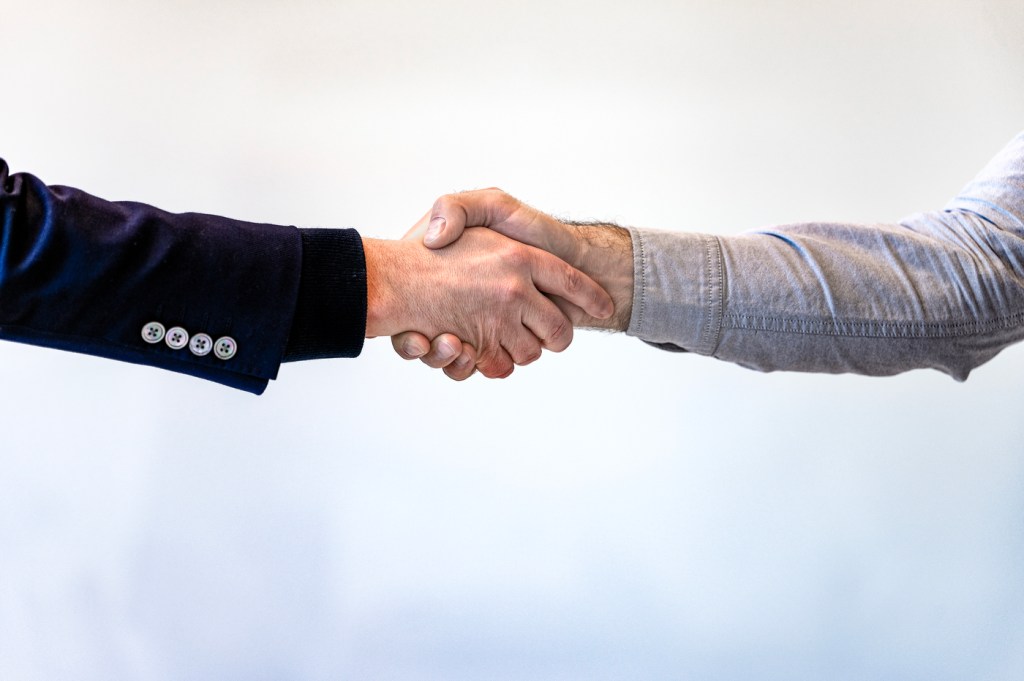 A handshake between two people.