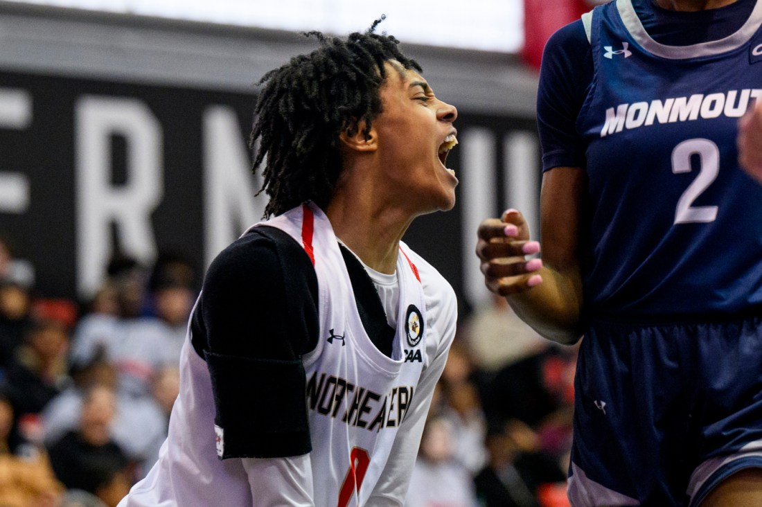 Northeastern basketball player yelling.