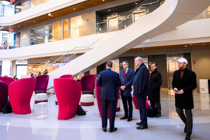 Simon Harris walks through the bottom floor of ISEC.