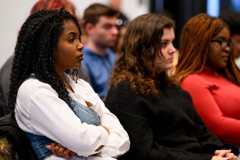 Audience members listening to Marty Baron.