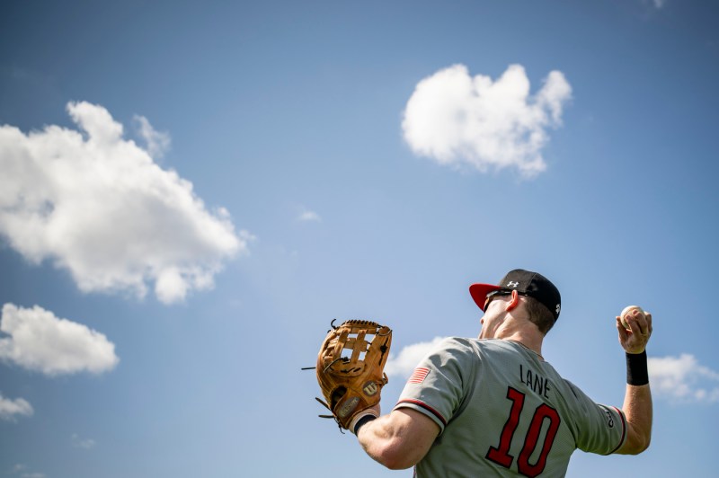 A baseball player gears up to throw a pitch.