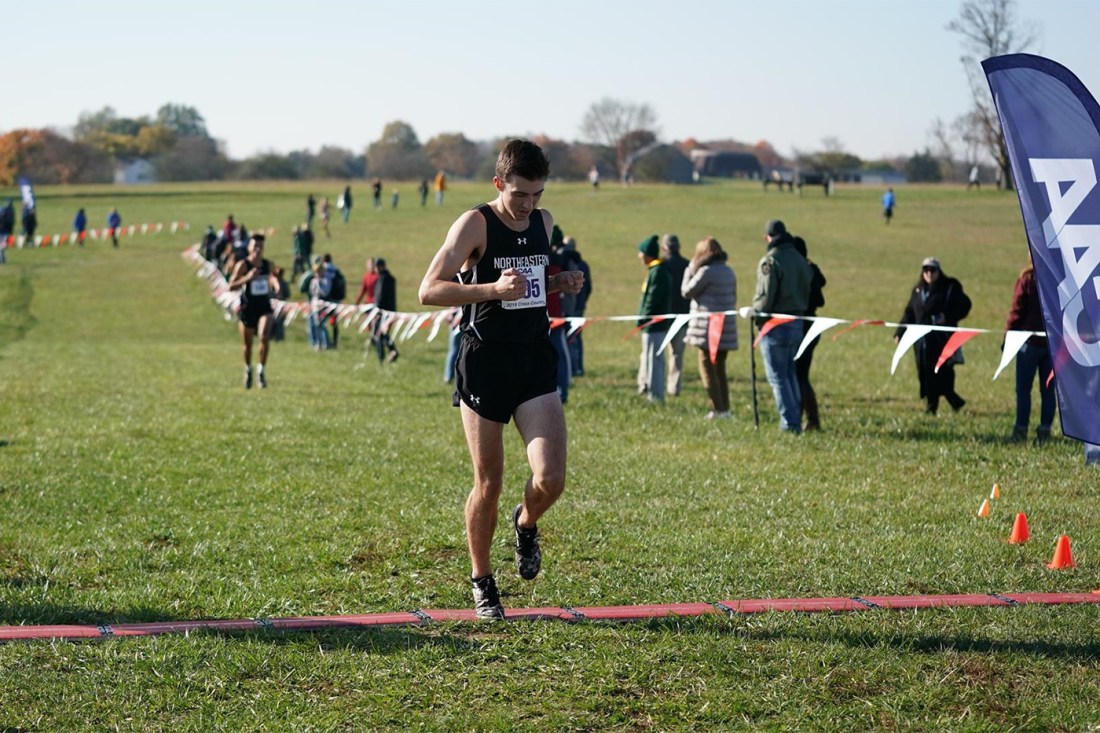 Cameron Dickson running in races for Northeastern's track team.