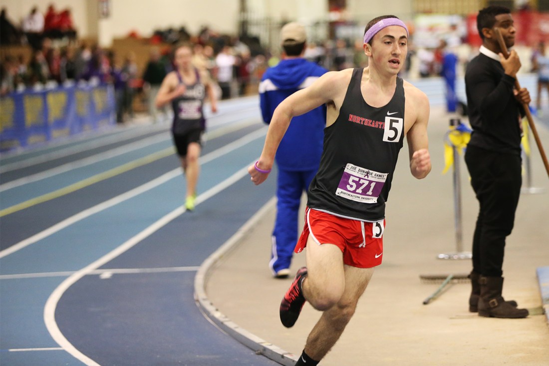 Michael Duggan running in a race on Northeastern's track team.