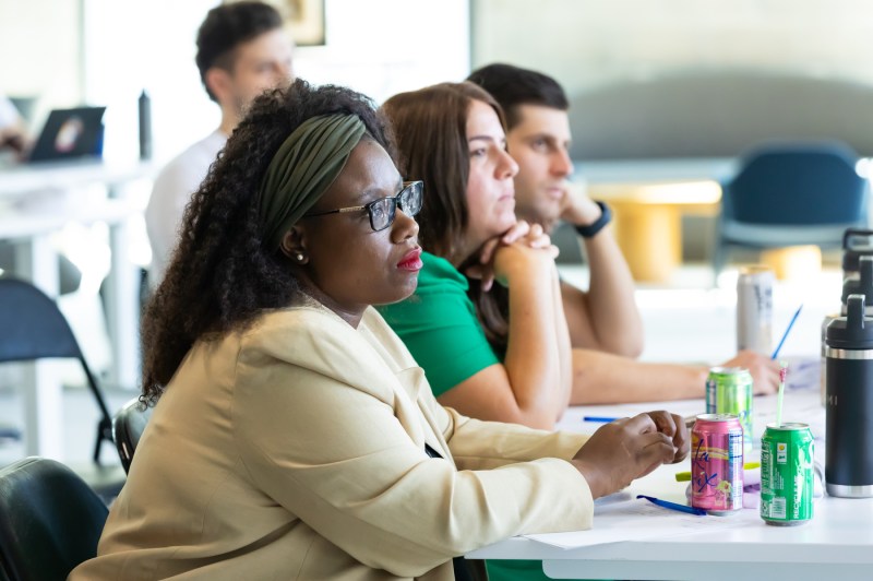 Students listening to a speaker at the Miami Fintech Trek Pitch Competition.