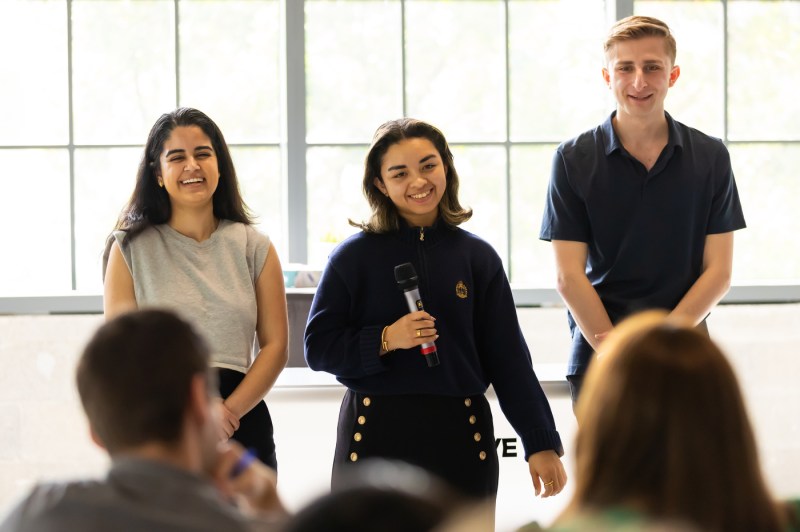 Students listening at the Miami Fintech Trek Pitch Competition.