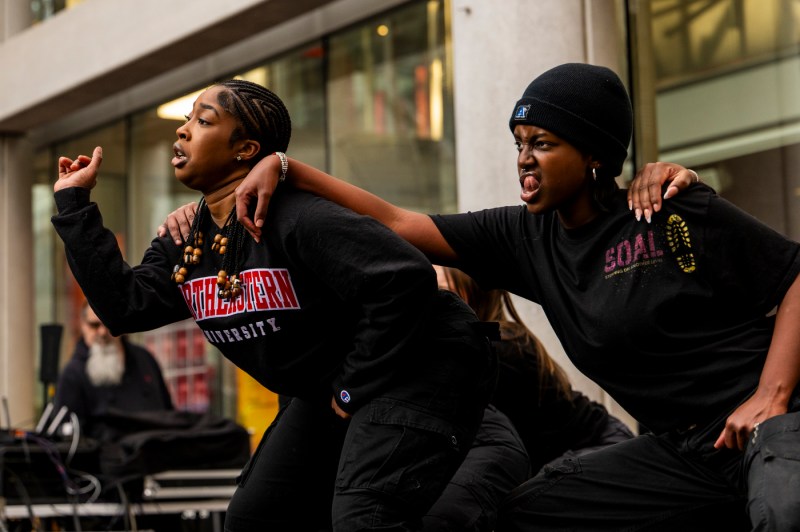 Two member of the Stepping On Another Level dance team striking a pose. 