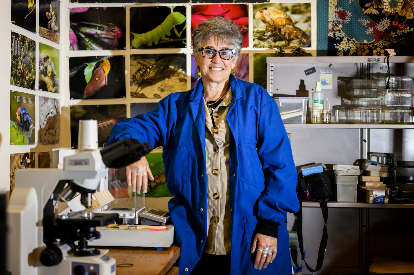 Rebeca Rosengaus posing in a blue lab coat.