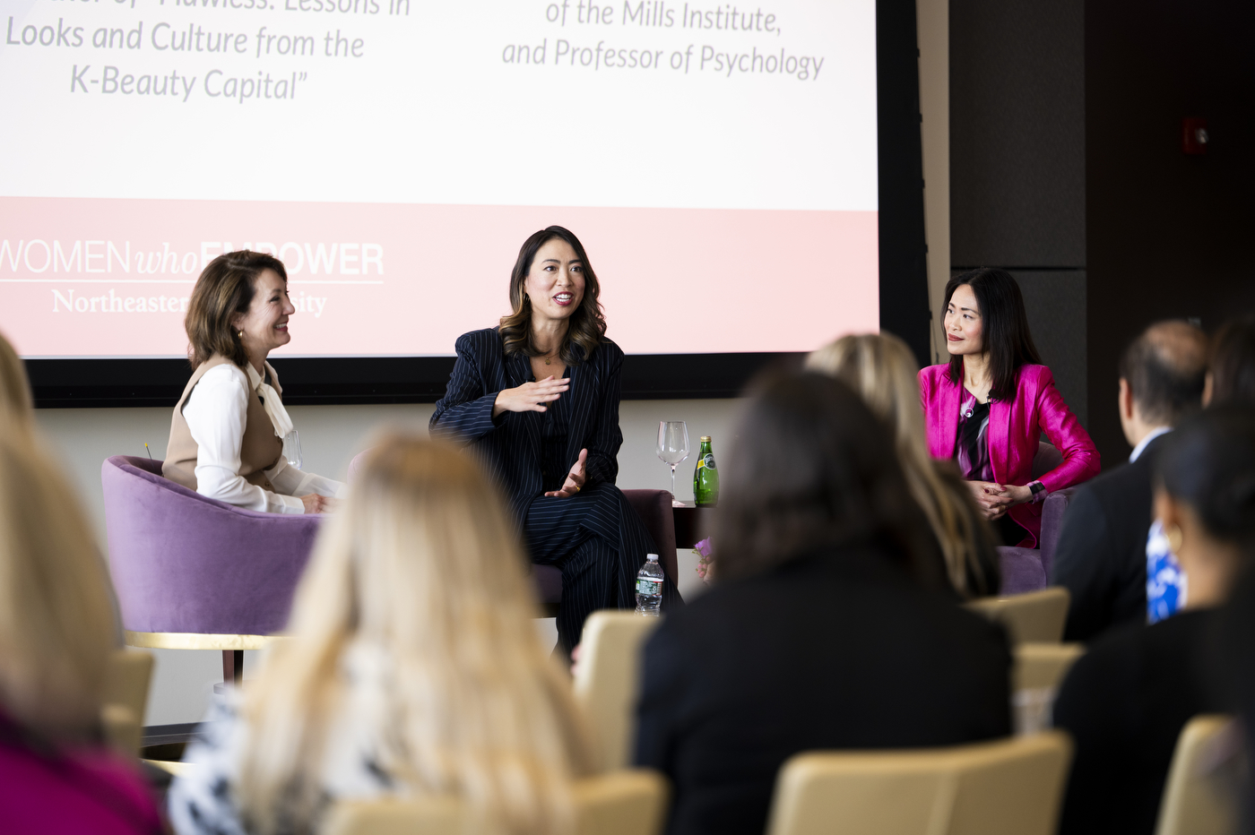 Elise Hu speaking at Women Who Empower event. 