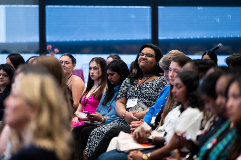 Audience members listening to Alli Webb at WISE Summit.