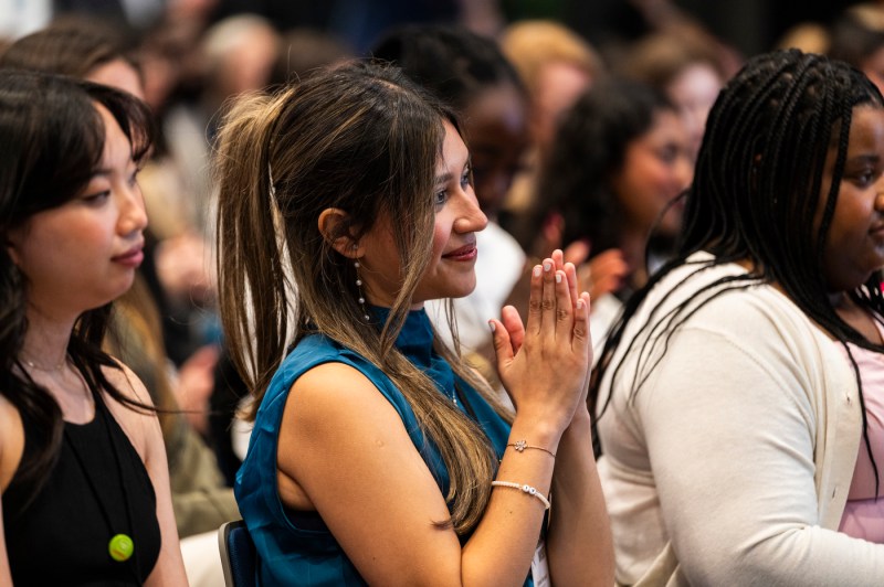 Audience members clapping at WISE summit.