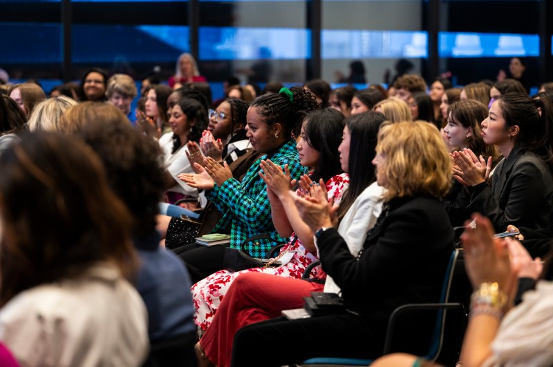 Audience members clapping at WISE Summit.