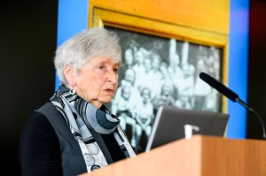 Eva Paddock speaking at a podium.