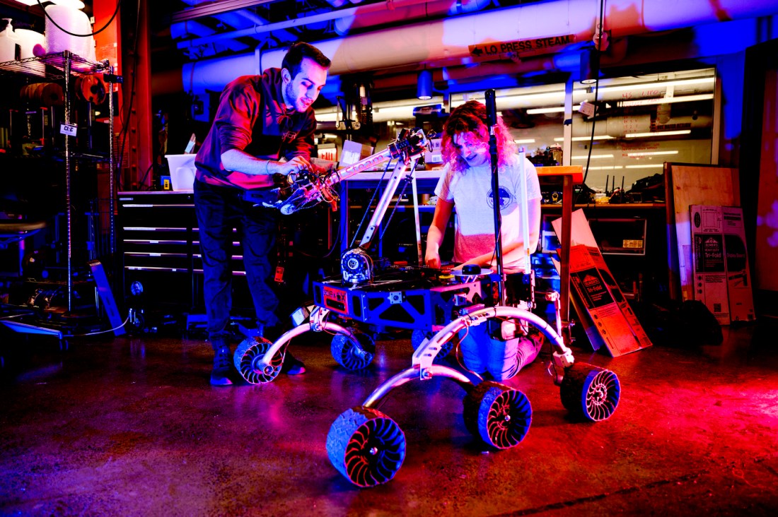 Brooke Chalmers and Jason Kobrin working on a Mars Rover.