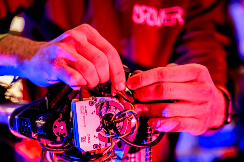 Jason Kobrin adjusting the wiring of the Mars Rover.