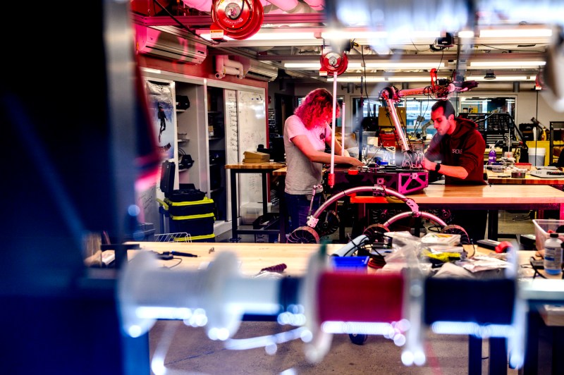 Brooke Chalmers and Jason Kobrin working on a Mars Rover.