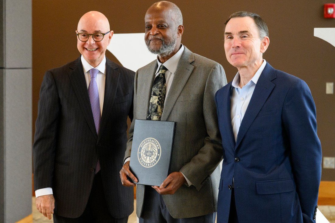 President Joseph Aoun and David Madigan posing with a Northeastern employee.