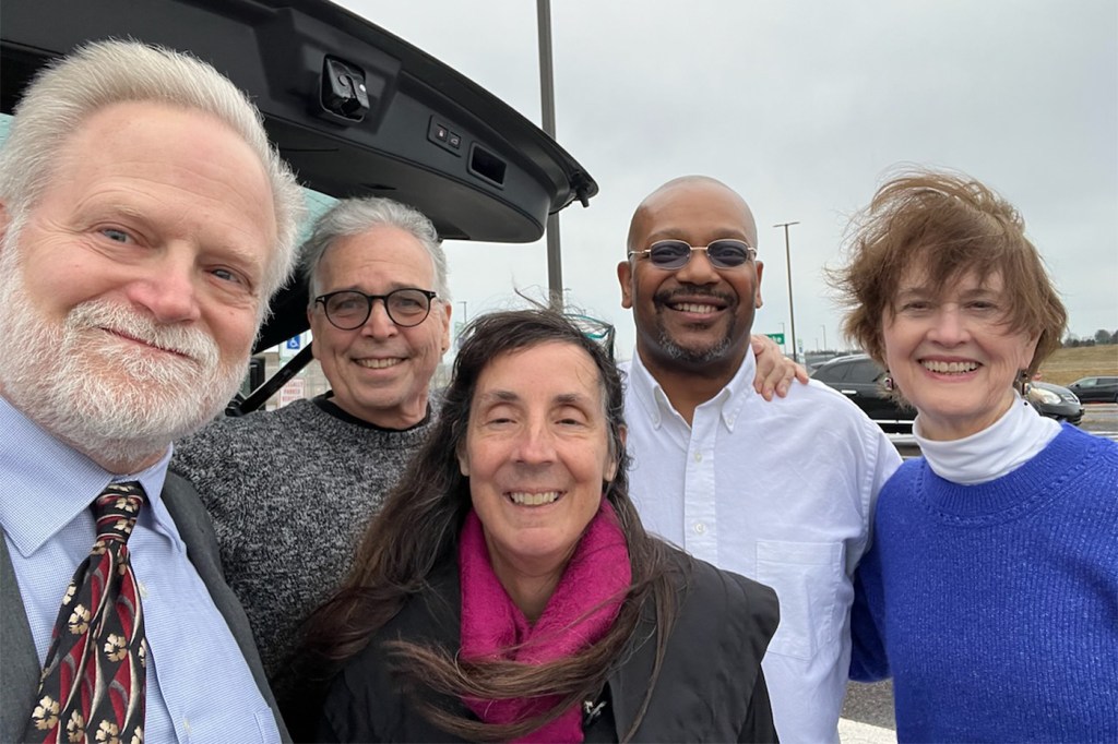 Daniel Gwynn posing with four other people.