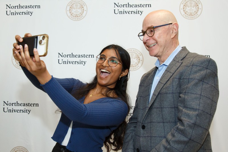 President Aoun posing for a selfie with another person.