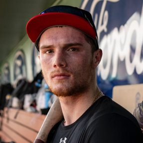 Headshot of Mike Sirota in the dugout