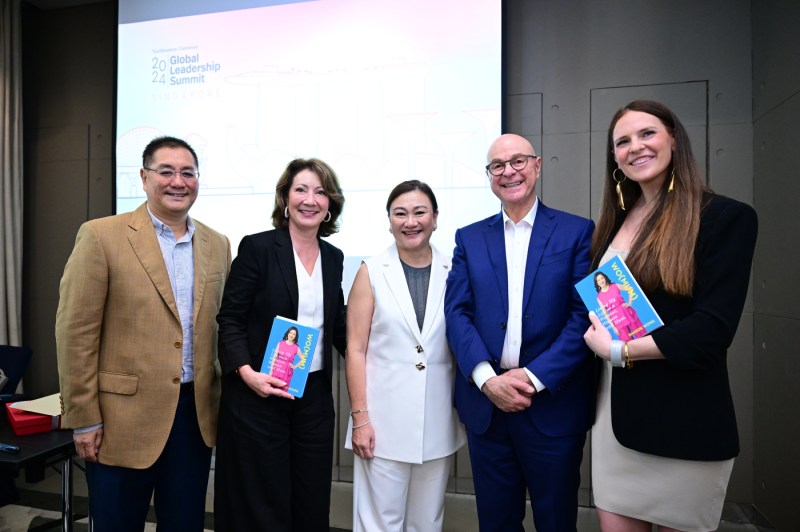 Diane Nishigaya MacGillivray and President Aoun posing with three other people at the Global Leadership Summit. 