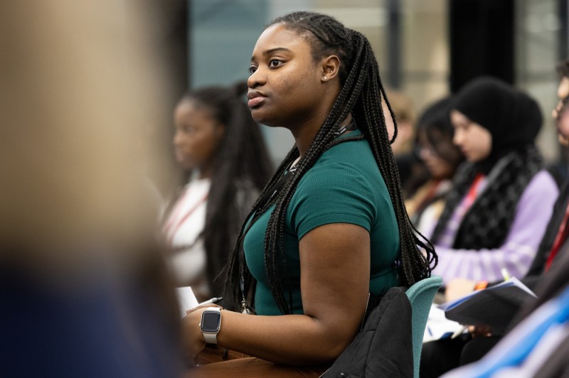 An audience member listening to a conference about Law and AI.