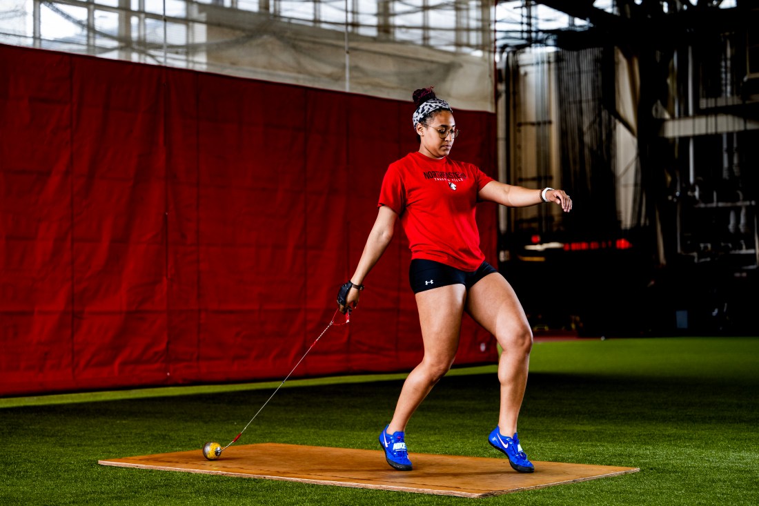 Liangie Calderon preparing to throw a hammer.