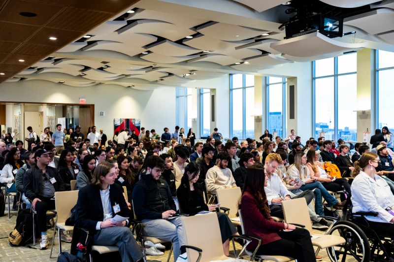 A room full of audience members.